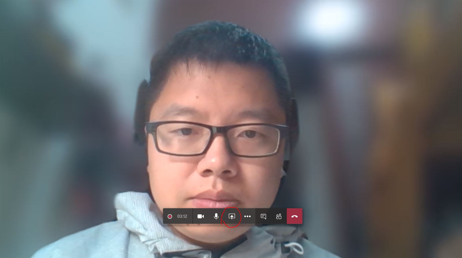 A person wearing glasses and looking at the camera

Description automatically generated